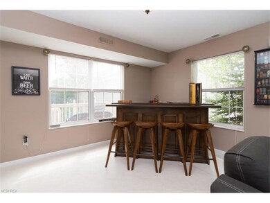 The dining area features a picture window overlook