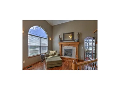 A great room fireplace invites chatting or relaxin