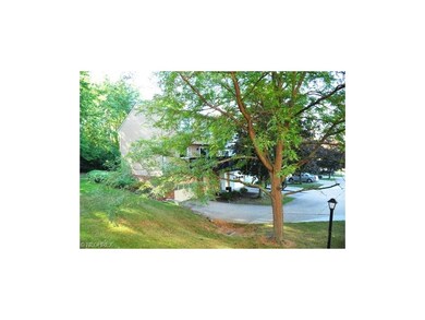 Generous green space around this end unit is very 