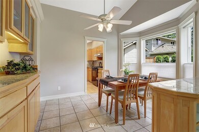 Bay window looks over the lovely vegetable garden and outdoor sitting area.