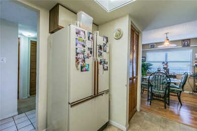 washer/dryer in closet next to refrigerator