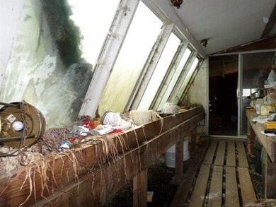 UNHEATED Area - Garden/Greenhouse at rear of home.