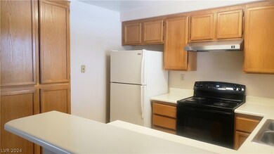 Step-saver kitchen with lots of storage. Pretty oa