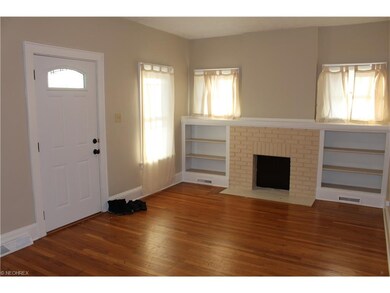 Living room featuring built-in bookcases.