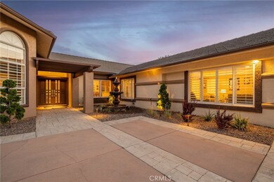 Beautiful double door entry with a gorgeous bubbling water fountain