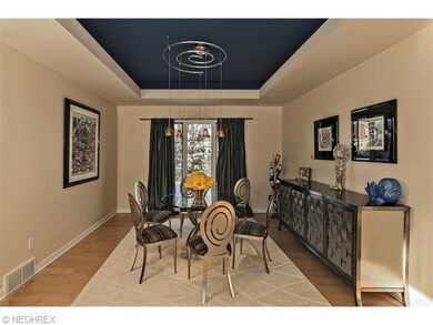 Formal dining room with blue accented cove ceiling