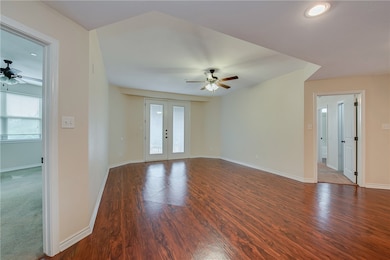 Spare room featuring dark hardwood / wood-style fl