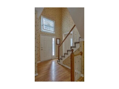 Soaring 2sty entry, hard wood floors, lots of natu