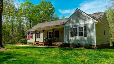 View of front of house with a porch, a front lawn,