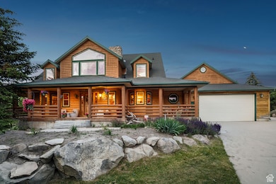 View of front of property with a porch, an attached garage, and concrete driveway
