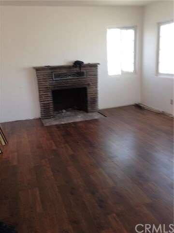 Fireplace in living room and also a fireplace in t