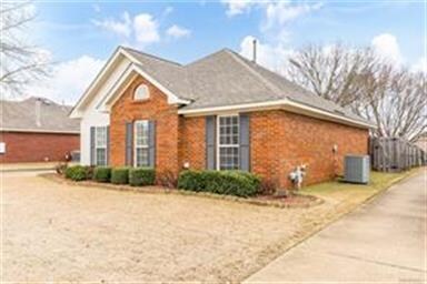 This beautiful brick home is low maintenance and m