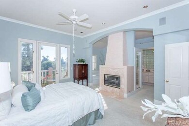 Incredible master suite with fireplace and balcony