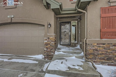 Entrance to property featuring a garage