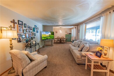 Large living room area with new carpet.
