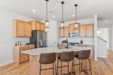 Kitchen area features wood stained cabinetry
