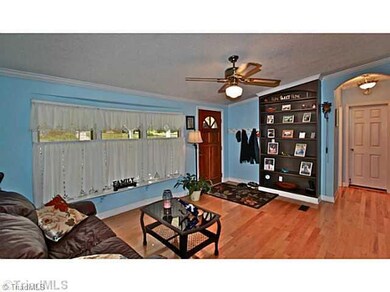 Living Room. Built-in shelves and wood floors just some of the upgrades