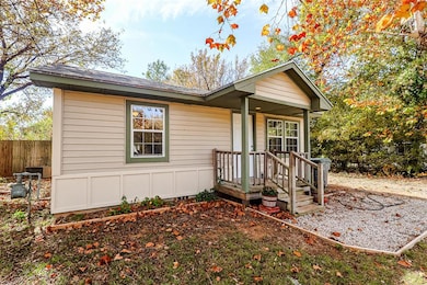 View of front of house featuring roof with shingles