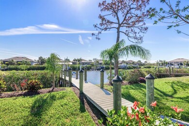 Composite dock walkway leads over berm to the boat dock.