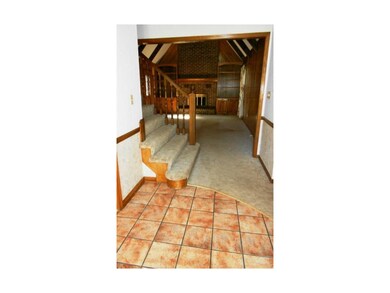 Large tiled foyer opens to family room, formal liv