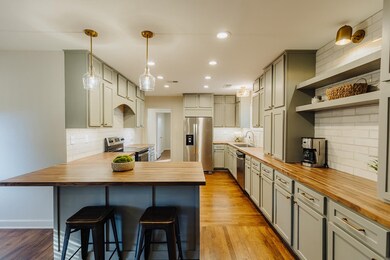 Kitchen with light hardwood / wood-style floors, a
