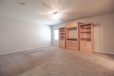 Down stairs master suite with movable entertainment storage.