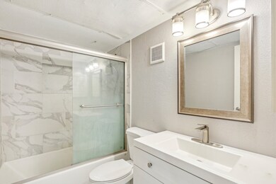 Updated bathroom with a tub/shower combo.