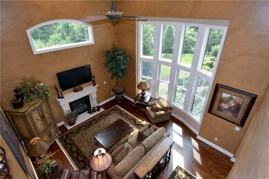 Relax in the impressive two-story family room deta