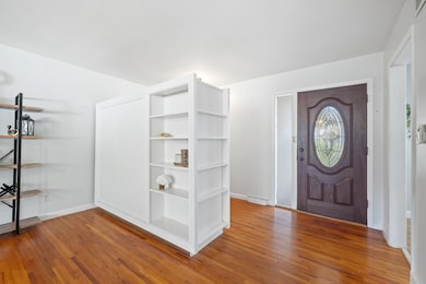 Foyer entrance featuring light wood-style floors