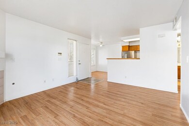 Unfurnished living room with a ceiling fan, light