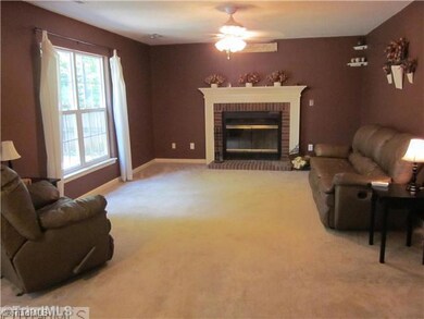 Den/Family/Great Room. Family room has new carpet and wood burning fireplace.