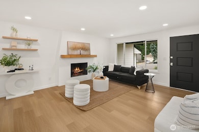 Woodburning fireplace and large windows.