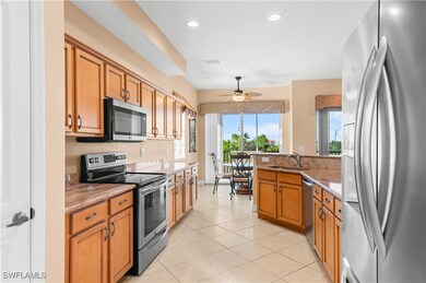 Kitchen featuring light tile patterned flooring, a