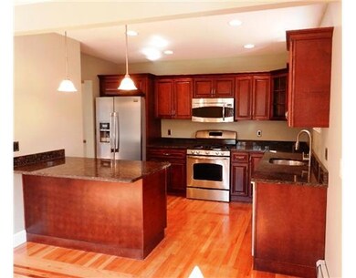 Kitchen. Cherry and granite kitchen, stainless app