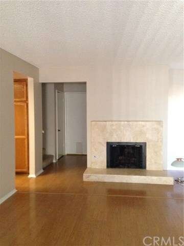 Large living room with marble fireplace and hearth