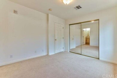 Bedroom 1, east, mirrored wardrobe closets