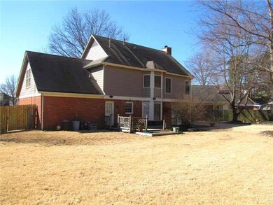 The backyard offers plenty of room for all your fa