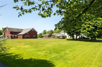 A side view of the house and barn