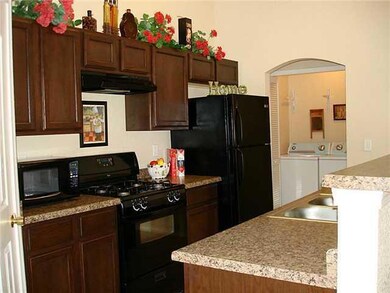 Kitchen view to hall laundry closet