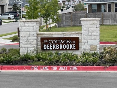 Community / neighborhood sign with fence and a re