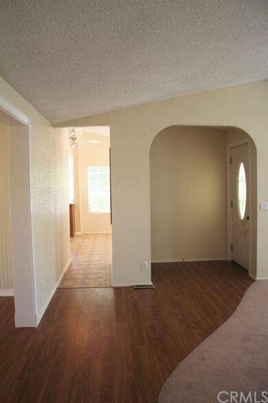 View from hall looking at front entry and short ha