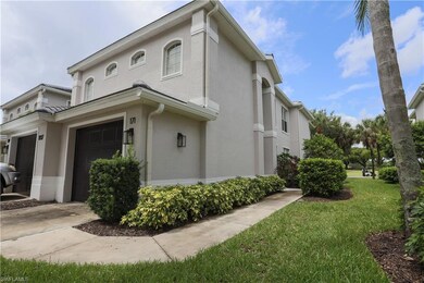 View of side of property with stucco siding, a garage, concrete driveway, and a yard