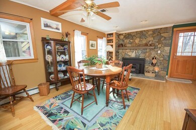 Natural stone fireplace with efficient wood stove 