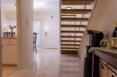 Staircase gives the downstairs an open concept fee