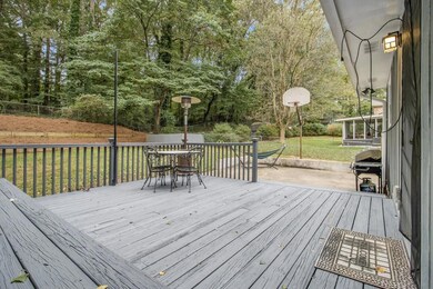 Expansive Rear Deck & Patio Overlooking A Fully Fenced Yard