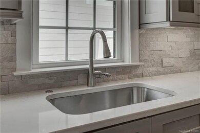 Quartz countertops, upgraded fixtures, window over