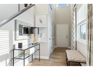 Dramatic and light-filled two-story foyer / main g