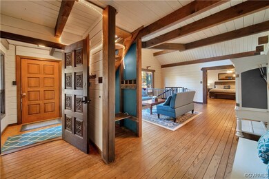 Entrance foyer with light hardwood / wood-style fl