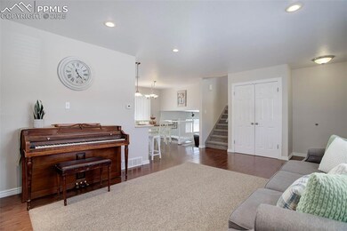 Living room with dark hardwood / wood-style floors
