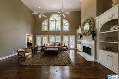 Two Story Family Room with Beautiful Wooden Blinds
